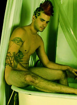 Punk With Mohawk and Tats Rubs in the Tub