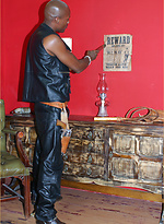 Gay black stallion wearing leather pulls his huge erection hard