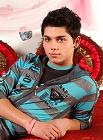 Latin twink Angelo strokes his thick cock.