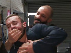Muscled mechanic, bound, fucked from both ends, and doused with cum